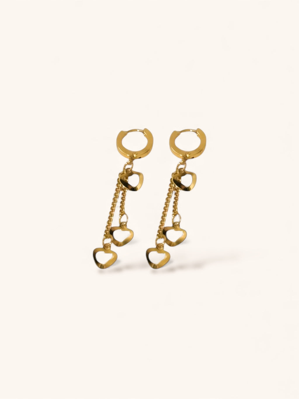 “Minimalist gold heart drop earrings for everyday wear”
