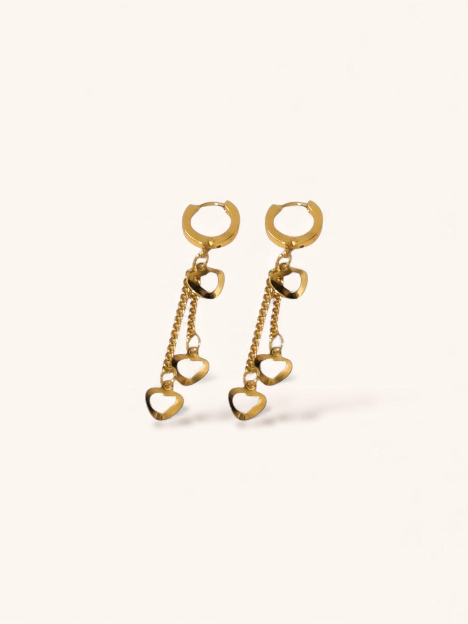 “Minimalist gold heart drop earrings for everyday wear”
