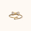 Gold-Plated Adjustable Bow Ring on Finger
Gold-plated BowLuxe adjustable ring worn on a finger, showcasing its elegant bow design and comfortable fit.
