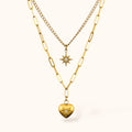 Gold-plated Celestia Necklace with double layers, shooting star pendant and heart pendant with mini zircons on neutral background