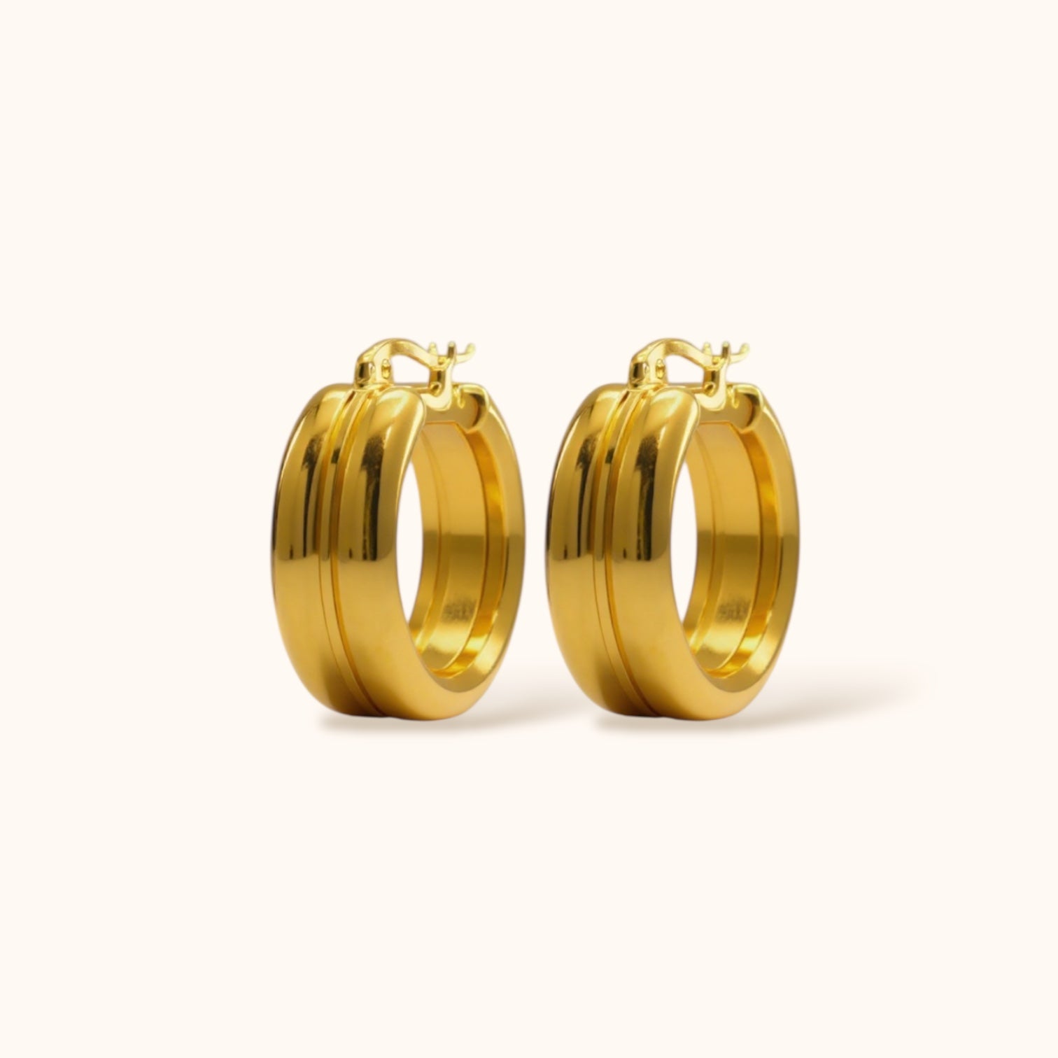 Gold-plated Duet Hoops large earrings with double-hoop illusion on neutral background