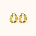 Gold-plated S925 sterling silver Mini Luxe Hoops on neutral background, small thick hoop earrings