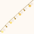 Elegant gold bracelet adorned with four-leaf clover accents for good luck