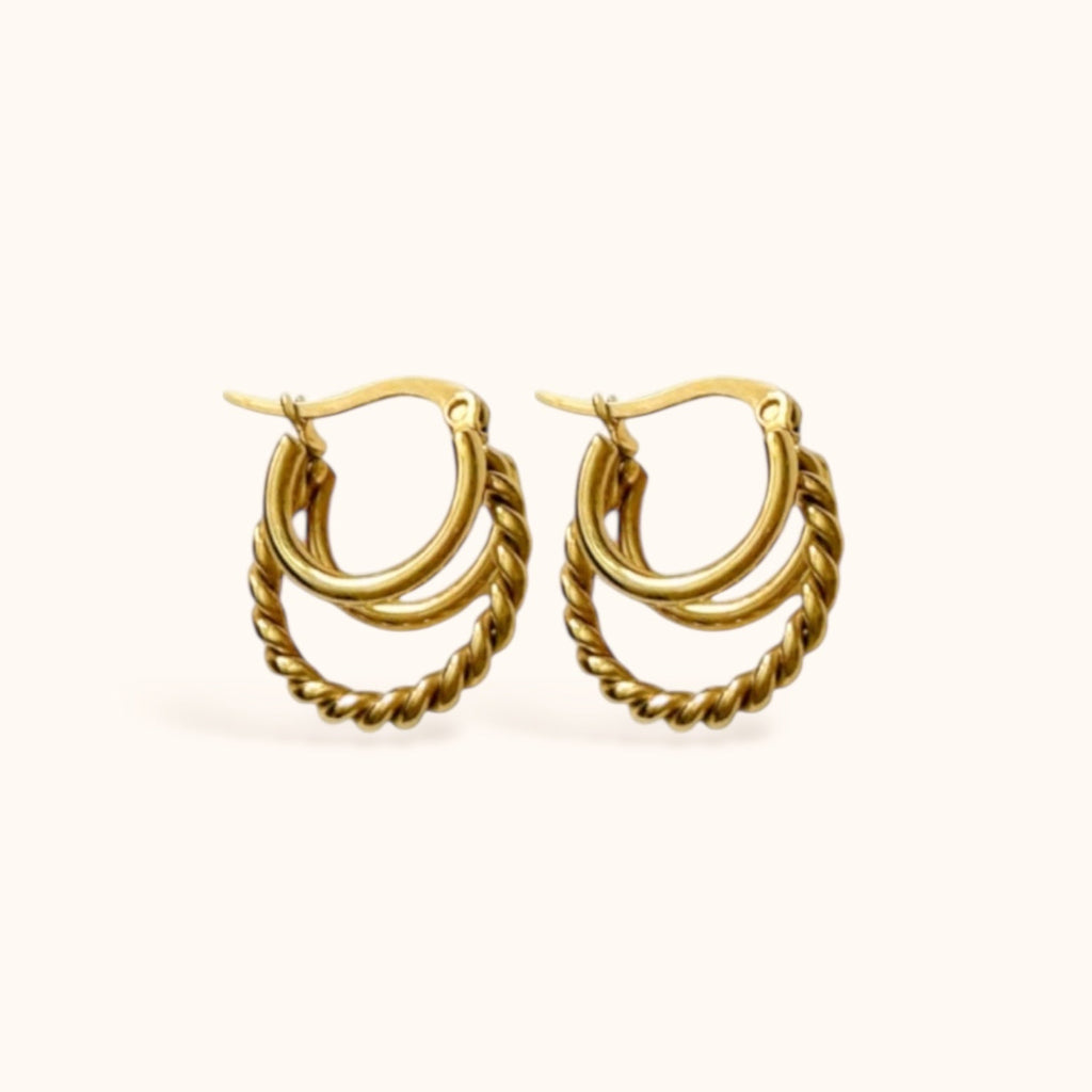 “Gold-plated layered hoop earrings with twisted center hoop”
