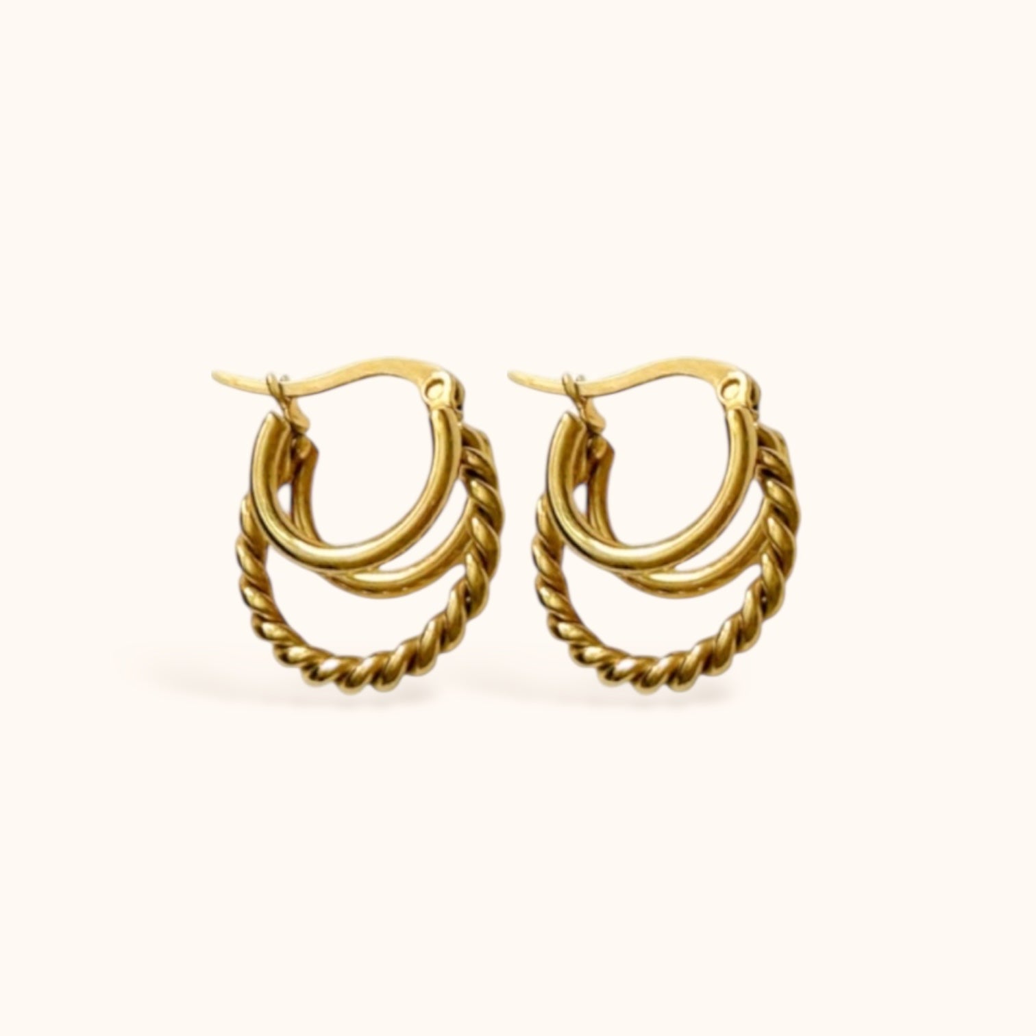“Gold-plated layered hoop earrings with twisted center hoop”
