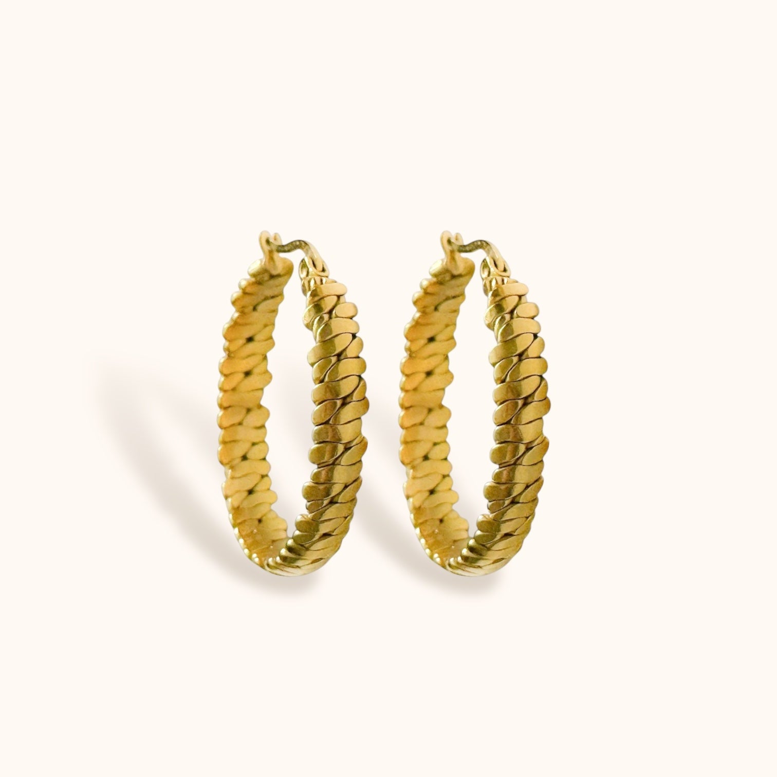 “Gold braided hoop earrings, minimalist statement design”