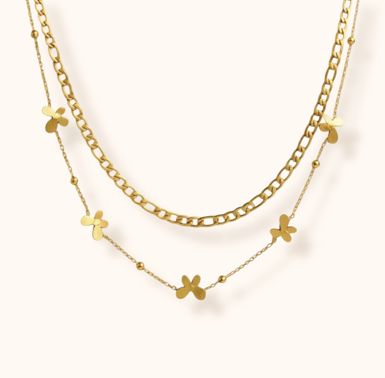 Gold layered double chain necklace featuring small butterfly charms, trendy dainty fashion accessory