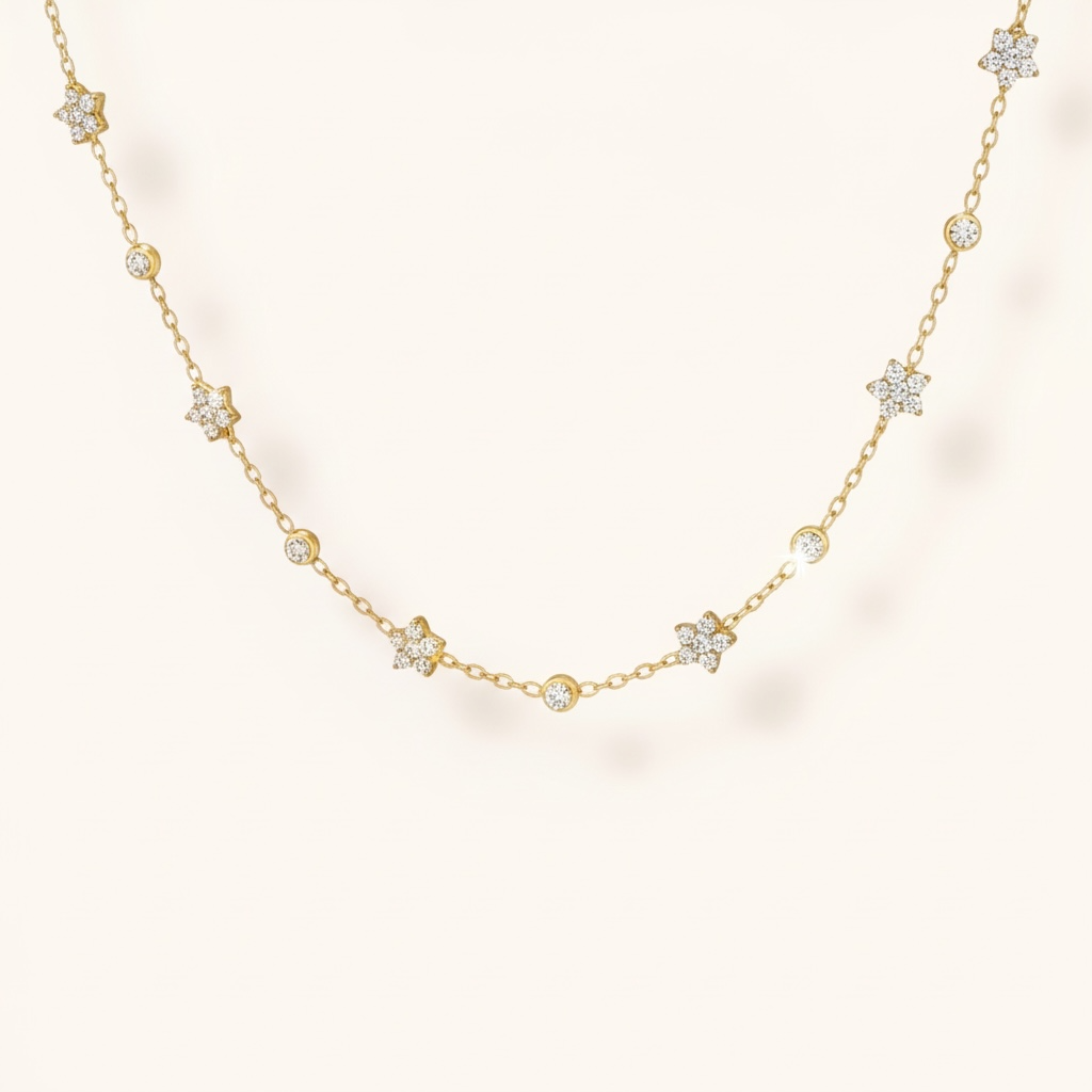 Gold necklace with diamond accents on a light background
