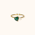 Gold-Plated Heart of Pearl Ring on Finger
The Heart of Pearl ring worn on a finger, displaying its elegant green heart pendant and small pearl charm.
