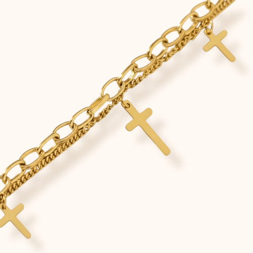 Modern gold chain bracelet with subtle cross details