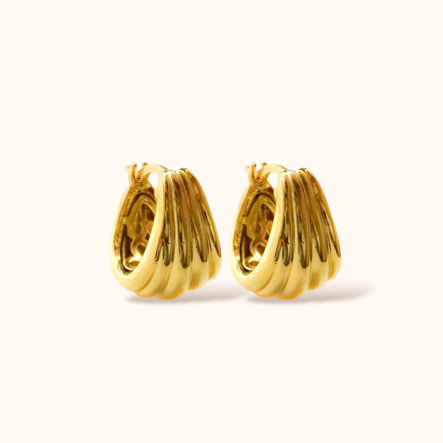 Trendy hooped earrings with unique textured gold finish