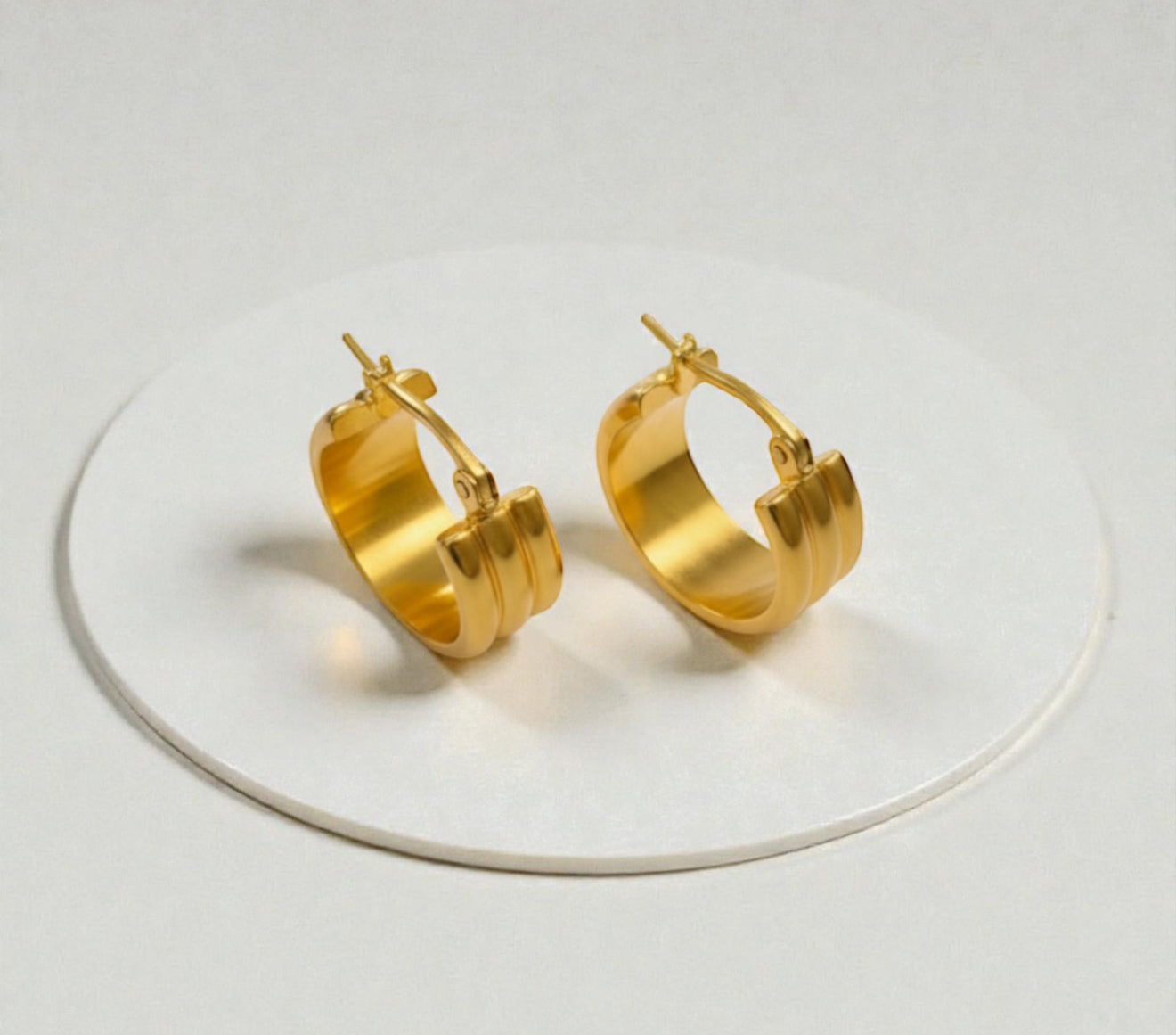 Thick gold triple hoop earrings styled for clean girl aesthetic outfits