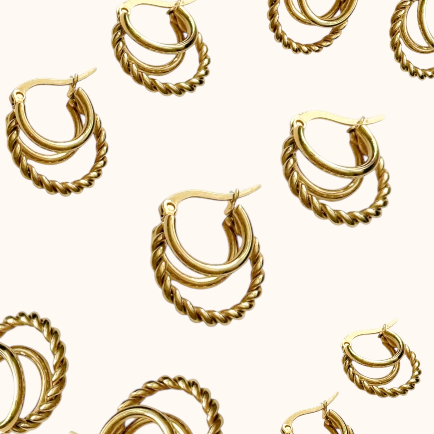 “Trio Twist Hoops sculptural gold statement earrings for women”
