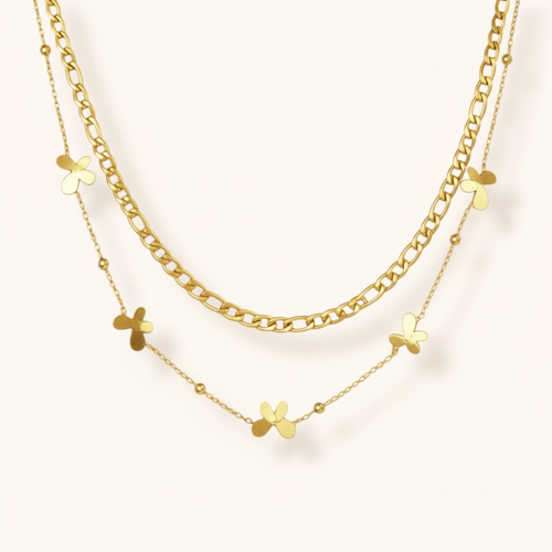 Layered gold double chain necklace featuring small butterfly charms, trendy dainty fashion accessory