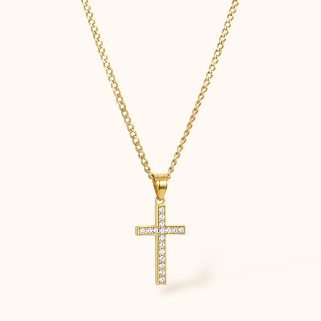Delicate gold cross necklace worn on neck