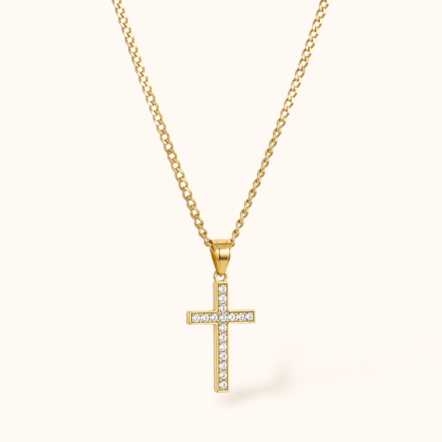 Delicate gold cross necklace worn on neck